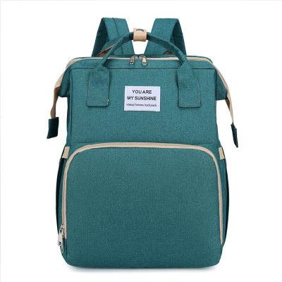 Sac à dos à langer lit voyage vert