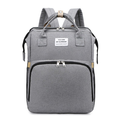 Sac à dos à langer lit voyage gris