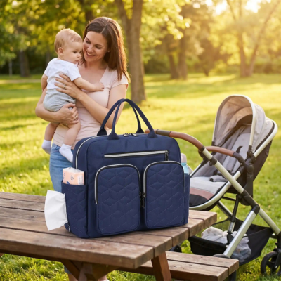 Sac à langer bandoulière ultra-organisé maman bébé bras table parc